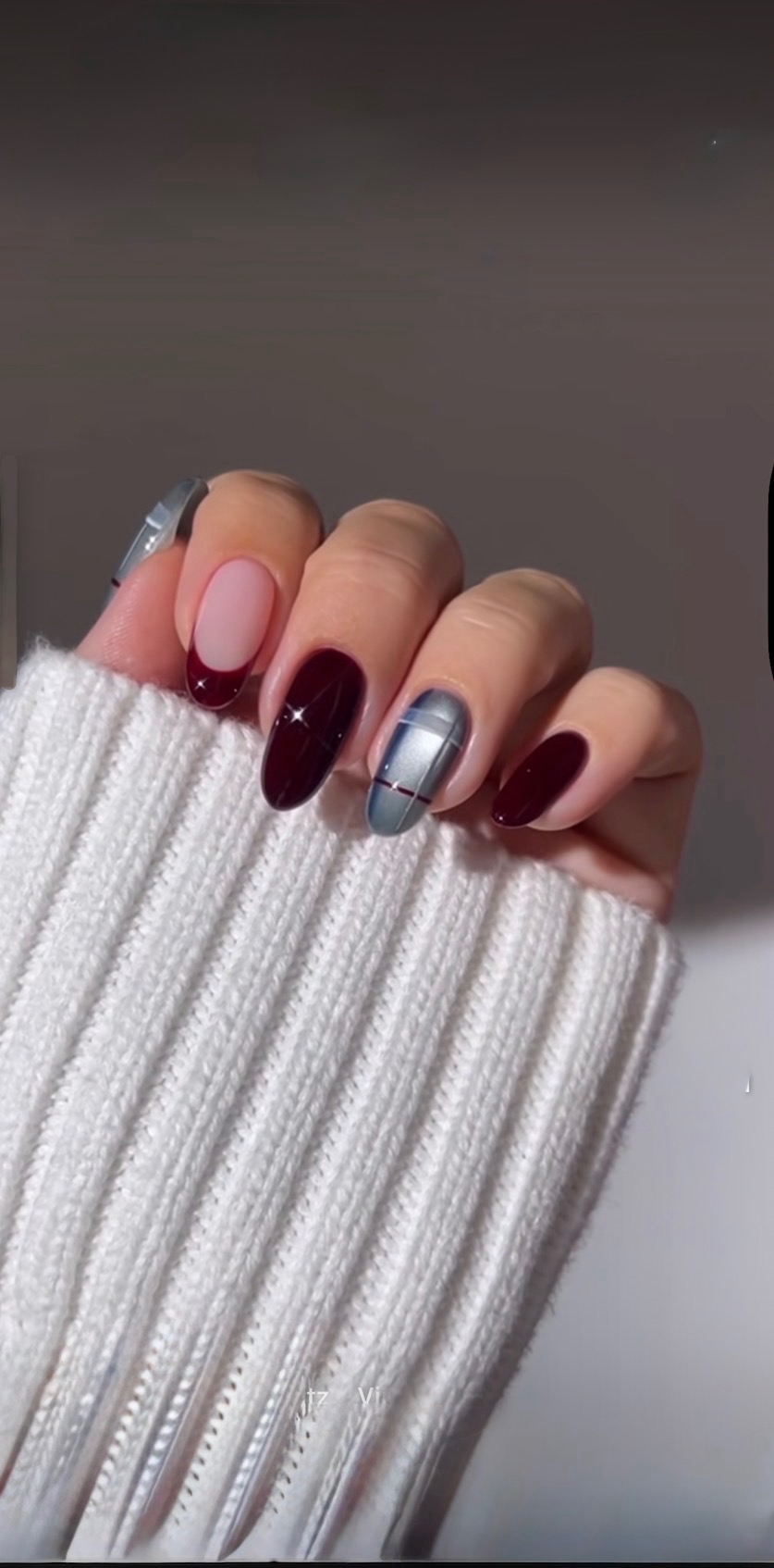 Burgundy and metallic manicure design