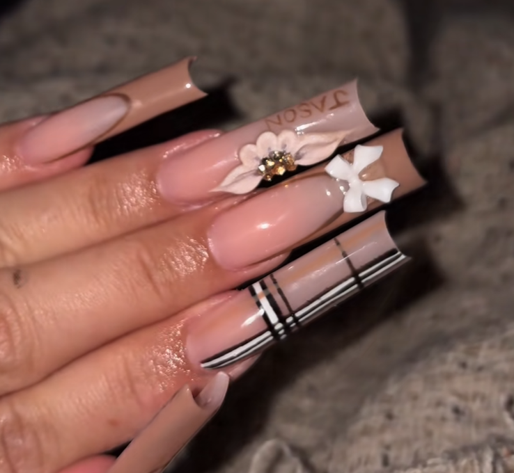 Neutral long nails with floral and plaid accents