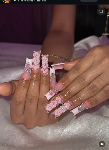 Pink floral nail art with rhinestones